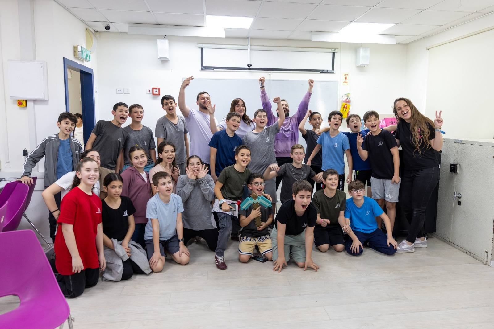 Students celebrating in classroom