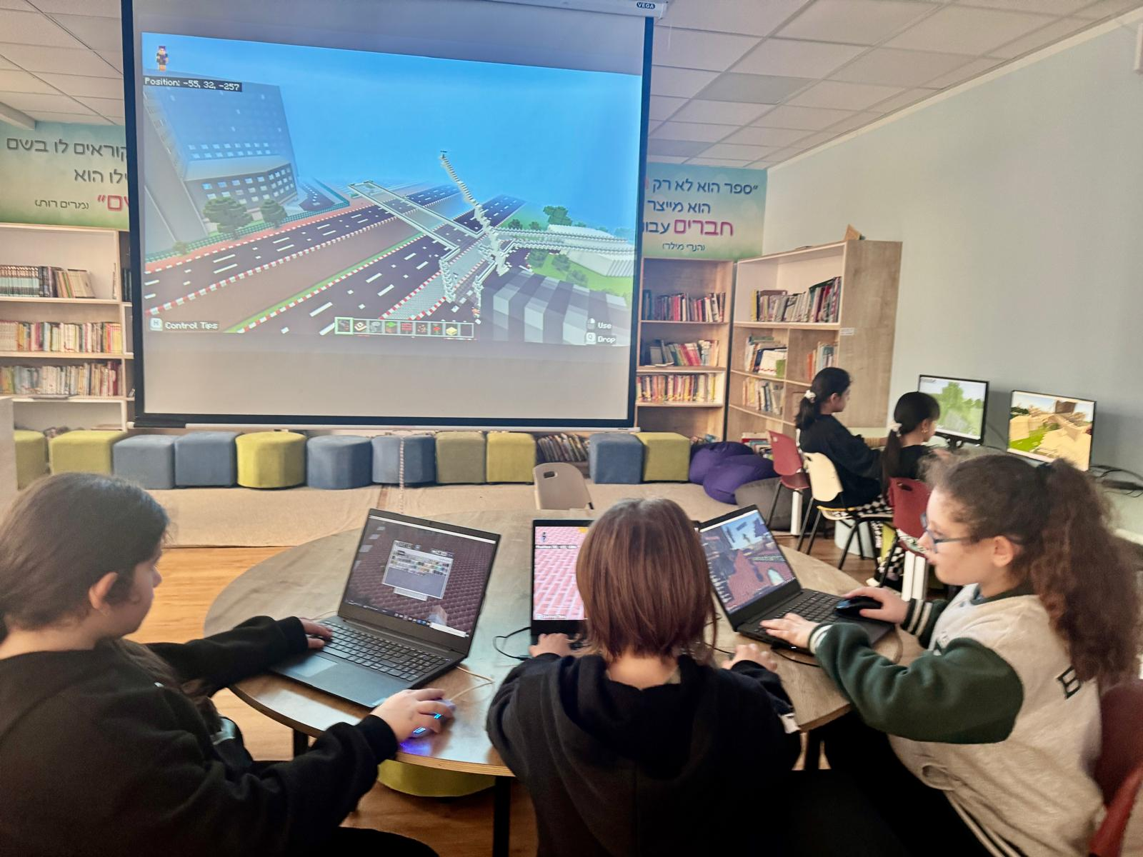 Students learning with Minecraft on projector